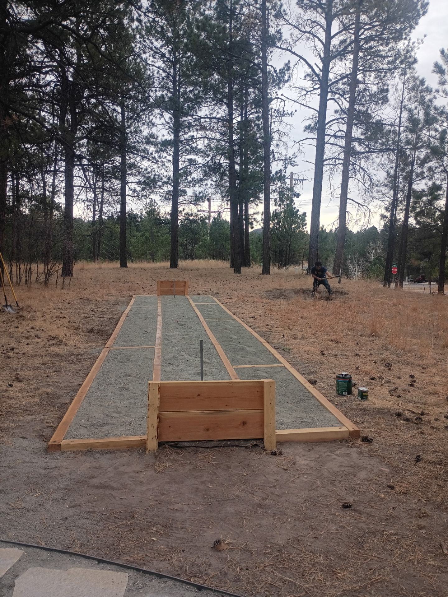Compacted gravel base with cedar forms set on a Lagos Landscaping job site